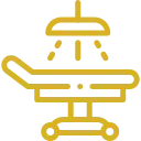 Icono dorado de una mesa de quirófano para realizar cirugías