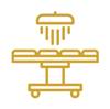 Imagen de un icono dorado de una mesa de examen médico.